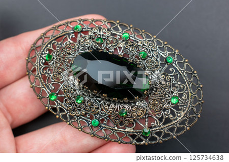 Brooch floral design vintage style laid flat photo Brooch floral design vintage style laid flat photo 125734638
