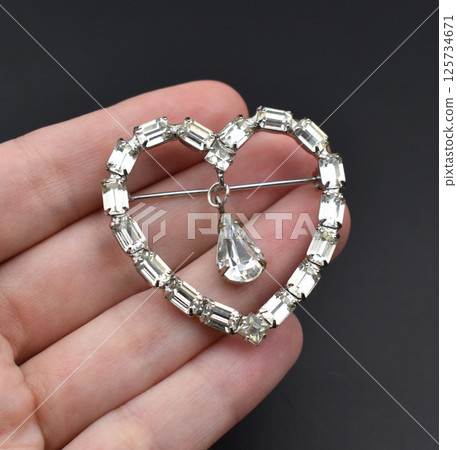 Romantic brooch floral vintage style image laid on linen 125734671