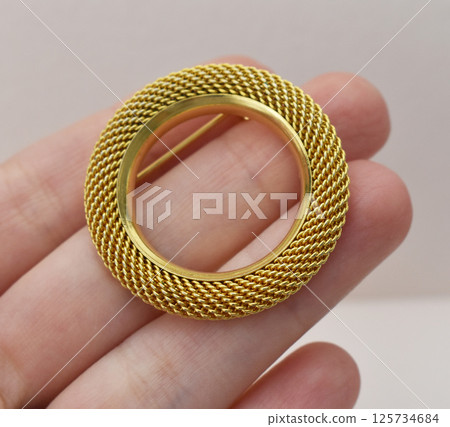 Brooch with vintage style floral charm on fabric photo 125734684