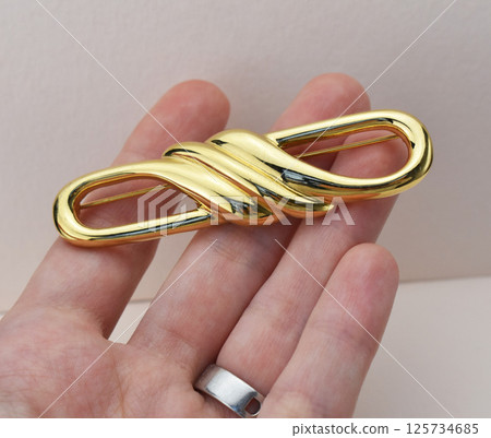 Brooch laid on soft surface vintage floral image Brooch laid on soft surface vintage floral image 125734685