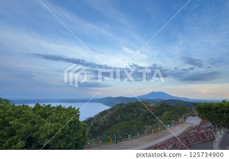 Stunning view of coastline and mountains at sunset near scenic overlook 125734900