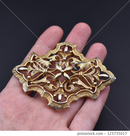 Brooch with floral handmade design on fabric photo 125735017