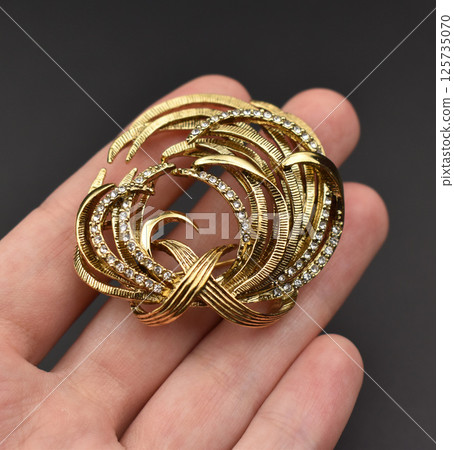 Retro brooch handmade floral design laid flat image Retro brooch handmade floral design laid flat image 125735070