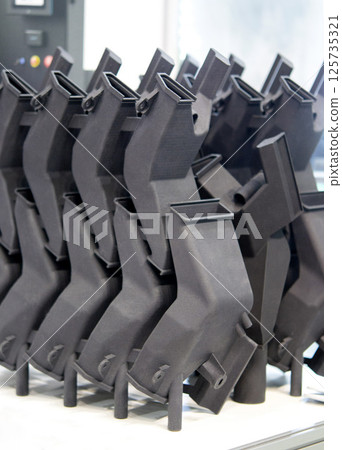 Plastic model printed on 3D printer from powder close-up. Objects created on 3D printer from polyamide powder. New 3D printing technology. Modern additive progressive 3D printing technologies. MJF 125735321