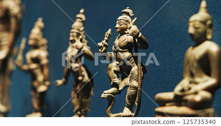 Old Ancient Bronze Figurines Of Indian Deities And Avatars. 10-19th Century Ce. Rama Avatara, Krishna Avatara, Buddha. Close-up View on Kalki Avatara Old Ancient Bronze Figurines Of Indian Deities And Avatars. 10-19th Century Ce. Rama Avatara, Krishna Avatara, Buddha. Close-up View on Kalki Avatara 125735340
