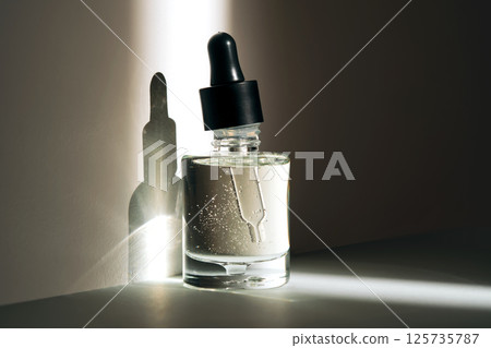 Face serum oil in the sun. 125735787