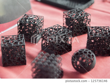 Plastic model printed on 3D printer from powder close-up. Objects created on 3D printer from polyamide powder. New 3D printing technology. Modern additive progressive 3D printing technologies. MJF Plastic model printed on 3D printer from powder close-up. Objects created on 3D printer from polyamide powder. New 3D printing technology. Modern additive progressive 3D printing technologies. MJF 125736146
