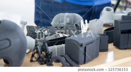 Plastic model printed on 3D printer from powder close-up. Objects created on 3D printer from polyamide powder. New 3D printing technology. Modern additive progressive 3D printing technologies. MJF 125736153