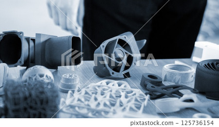 Plastic model printed on 3D printer from powder close-up. Objects created on 3D printer from polyamide powder. New 3D printing technology. Modern additive progressive 3D printing technologies. MJF 125736154
