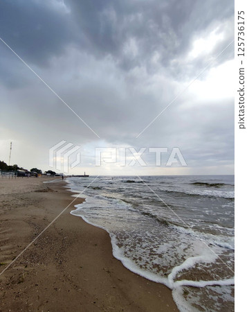 Rain and storm at sea. Dark storm clouds, rain and sea surface. Stormy weather. Storm at sea. Nature. Natural background. Rain and storm at sea. Dark storm clouds, rain and sea surface. Stormy weather. Storm at sea. Nature. Natural background. 125736175