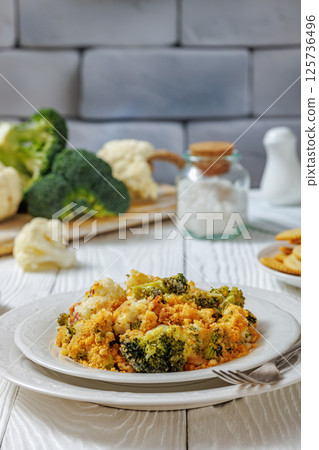 broccoli cauliflower casserole on plate, top view 125736496
