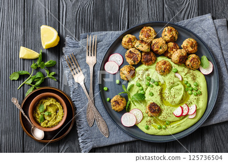 chicken broccoli meatballs with green pea hummus 125736504