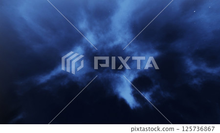 Looking up at the cloudy night starry sky and floating clouds 125736867