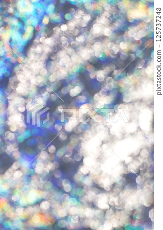 Colorful abstract bokeh with shimmering light and rainbow reflections 125737248