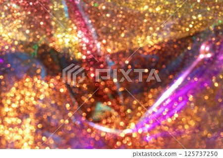Vivid sparkling multicolored glitter lights forming an abstract festive composition Vivid sparkling multicolored glitter lights forming an abstract festive composition 125737250