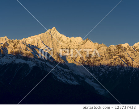 China's Yunnan Province, Meili Snow Mountains The summit of Kawakabu, the main peak dyed in the morning sun / Meili Snow Mountains 125737438