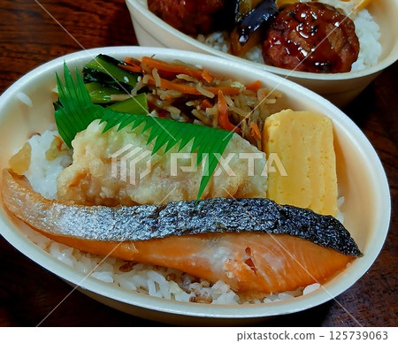 Mochi barley and salmon bento - chikuwa, omelette, and kinpira burdock 125739063