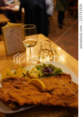White wine and schnitzel White wine and schnitzel 125741826