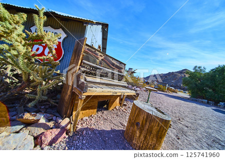 Rustic Piano on Route 66 with Cactus and Spool Eye Level View 125741960