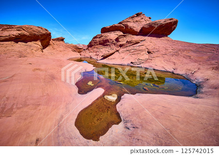 Desert Red Rock Reflection with Blue Sky at Eye Level 125742015