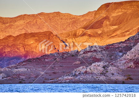 Desert Sunset Over Rocky Mountains with Reflective Water Aerial Desert Sunset Over Rocky Mountains with Reflective Water Aerial 125742018