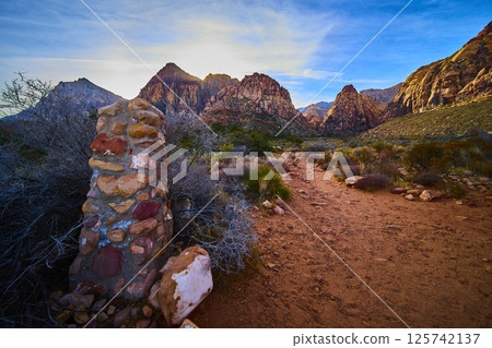 Red Rock Canyon Desert Path and Cairn at Golden Hour Eye-Level View 125742137