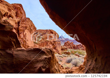 Redstone Dune Desert Vista Through Natural Arch in Nevada Redstone Dune Desert Vista Through Natural Arch in Nevada 125742194