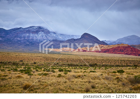 Red Rock Canyon Sandstone and Clouds at Sunrise Low Perspective Red Rock Canyon Sandstone and Clouds at Sunrise Low Perspective 125742203