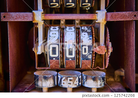 Vintage Mechanical Counter in Rusty Frame Eye-Level Close-Up Vintage Mechanical Counter in Rusty Frame Eye-Level Close-Up 125742208