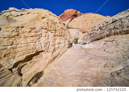 Red Rock Sandstone Cliffs Under Blue Sky Eye-Level Perspective 125742220