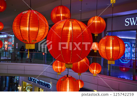 Vibrant Red Lanterns in Modern Mall Eye Level Perspective 125742259