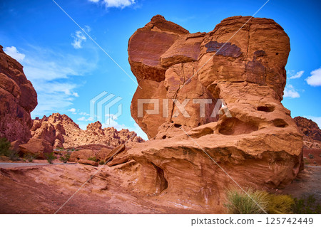 Majestic Rock Formations in Nevada Desert Under Clear Blue Sky, Eye-Level View 125742449
