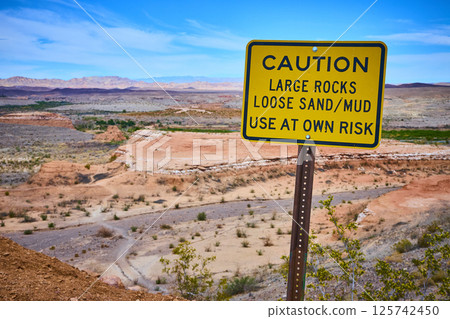 Caution Sign in Desert Landscape Boulder City Nevada Eye-Level View 125742450