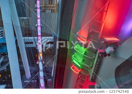 Neon Ferris Wheel and Cityscape at Dusk Aerial Perspective 125742548