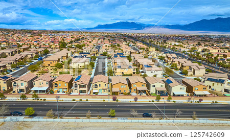 Aerial of Las Vegas Suburb with Solar Panels and Desert Landscape 125742609