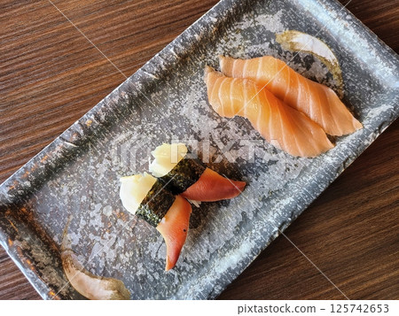 Sushi Artistry with Salmon and Clam Nigiri Overhead View Sushi Artistry with Salmon and Clam Nigiri Overhead View 125742653