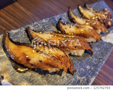 Gourmet Unagi Sushi on Slate Plate Close Up 125742703