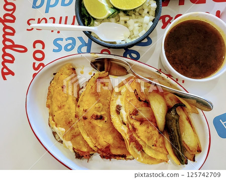 Mexican Birria Tacos with Consomme Overhead View 125742709