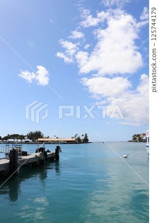 The tranquility of the harbor and the expansive blue sky The tranquility of the harbor and the expansive blue sky 125744179