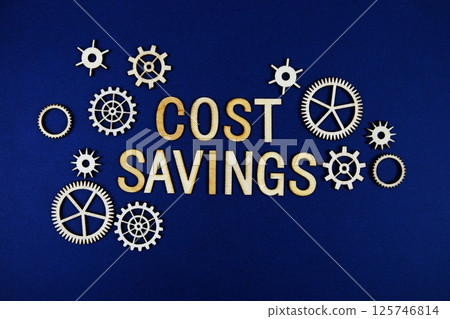 Cost Savings alphabet letters with gears element on navy blue background Cost Savings alphabet letters with gears element on navy blue background 125746814