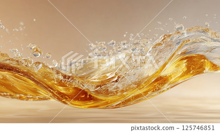 A beautiful background of golden liquid splashing. The movement of gold liquid and splashes exudes a premium feel. 125746851