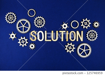Solution alphabet letters with gears element on navy blue background 125746959