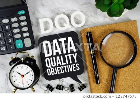 DQO - Data Quality Objectives acronym with calculator, alarm clock and magnifying glass, Business concept background DQO - Data Quality Objectives acronym with calculator, alarm clock and magnifying glass, Business concept background 125747573