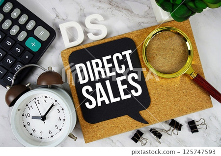DS - Direct Sales acronym with calculator, alarm clock and magnifying glass, Business concept background 125747593