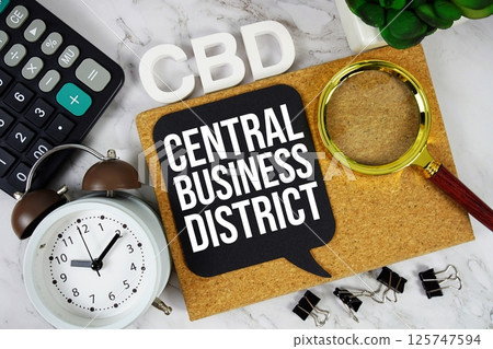 CBD - Central Business District acronym with calculator, alarm clock and magnifying glass, business concept background 125747594
