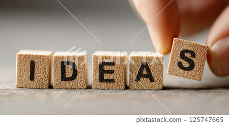 Ideas wooden block hand picking letter row text concept creativity inspiration Ideas wooden block hand picking letter row text concept creativity inspiration 125747665