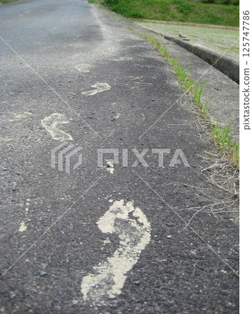 Asphalt footprints 125747786