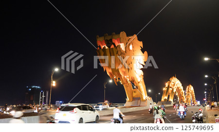 far view of dragon bridge in da nang. This modern bridge crosses the Han River at the Le Dinh Duong, Bach Dang traffic circle 125749695