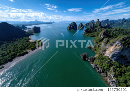 Breathtaking aerial view of tropical bay with limestone islands, lush greenery, and clear blue skies. serene water reflects vibrant landscape, creating tranquil and picturesque scene 125750201
