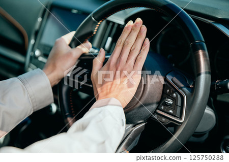 A young man in his 20s driving a car A young man in his 20s driving a car 125750288